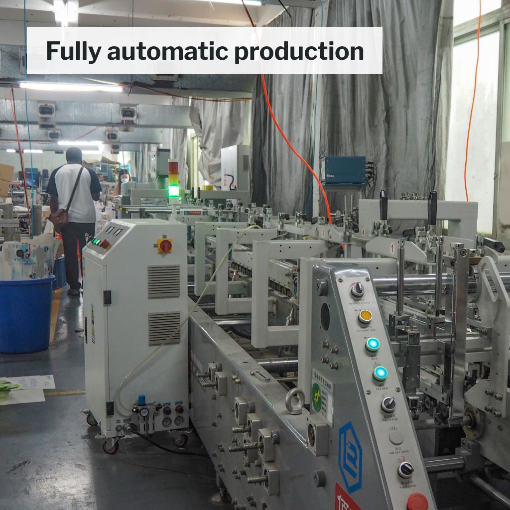 Automatic UV printing machine used in packaging production.