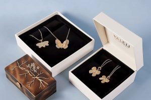 Luxury custom jewelry boxes with black velvet insert for necklaces and pendants.