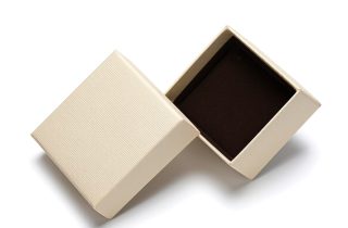Minimalist beige two-piece jewelry box with a dark brown velvet interior.